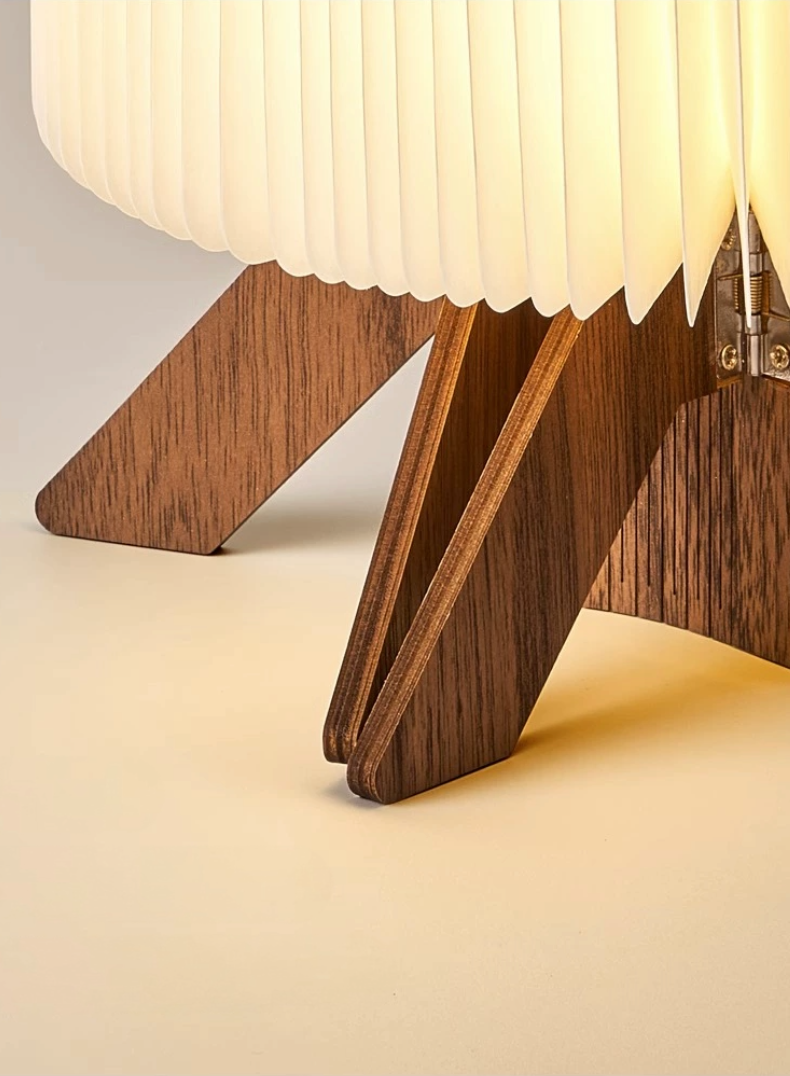 Warm wood folding portable paper lamp with accordion shade, elegant home decor accent.